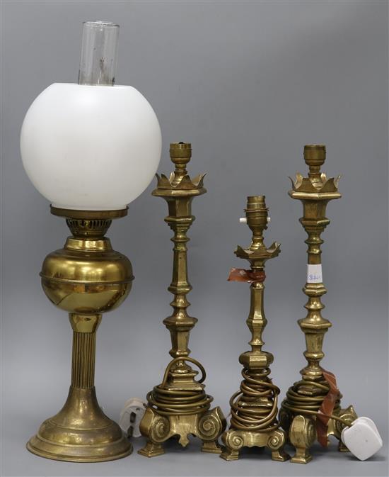 Three brass lamps and an oil lamp tallest 42cm